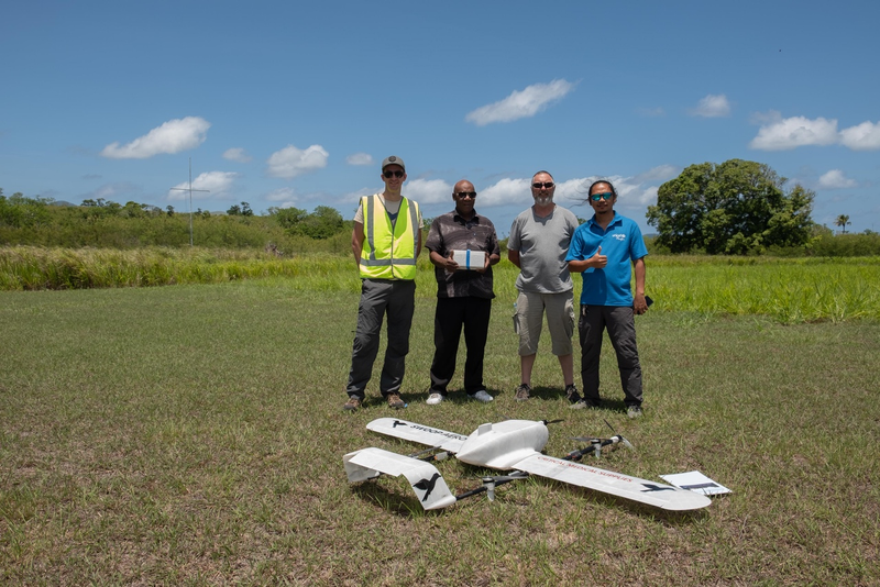 From left to Right, Joss Tepper CTO of Swoop Aero, Leonard Tabilip EPI National Coordinator MOH Vanutu, JimCoyne UAV advisor to CAAV, Doctor Ridwan Gustiana Immunisation Offcier UNICEF Vanuatu infront of Swoop Aero Drone after it successfully completed its third and final scored flight